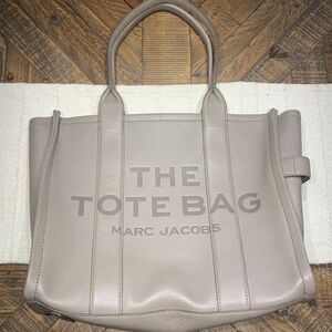 The Tote Bag Marc Jacobs. 13 1/2 inches high. 16 1/2 inches wide.